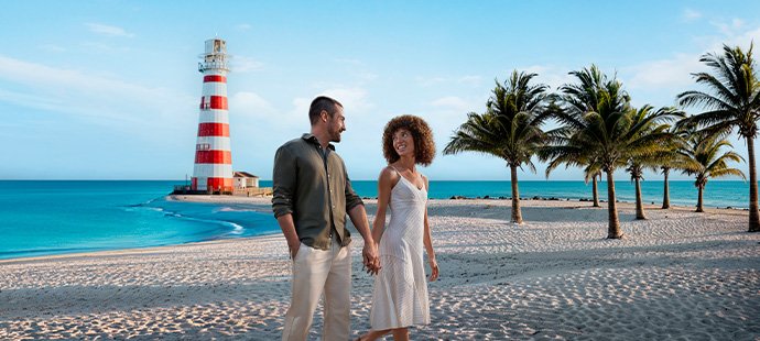 Cruises in the caribbean, cruise holiday, couple on beach with palm trees | MSC Cruises